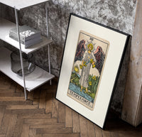 Winged angel pouring water between cups poster in a black frame leaning beside a shelf in a raw-plaster loft