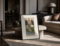 Winged angel pouring water between cups print in a black frame leaning on a travertine table in a sunlit lounge