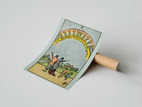 Gently curled Ten of Cups print beside its protective shipping tube