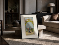 Ten of Cups tarot family print in a black frame leaning on a travertine table in a sunlit lounge