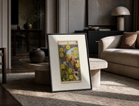 Ten of Pentacles tarot card print in a black frame leaning on a travertine table in a sunlit lounge