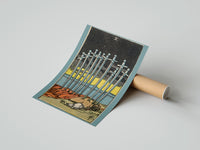Gently curled Ten of Swords print beside its protective shipping tube