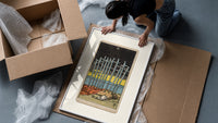 Ten Swords Tarot card framed print being unpacked from protective bubble wrap and a box
