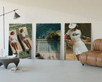 Tennis Club Poster Set three-panel set displayed beside a brown leather sofa