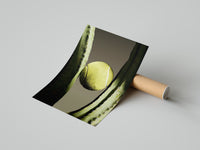 Woman kneeling on a concrete floor unrolling the tennis and cactus minimal sports print