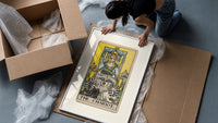 The Chariot tarot card figure framed print being unpacked from protective bubble wrap and a box