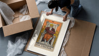 Bearded emperor on stone throne framed print being unpacked from protective bubble wrap and a box