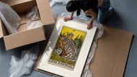Empress on throne with crown framed print being unpacked from protective bubble wrap and a box