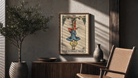 The Hanged Man poster framed above a fluted sideboard beside a potted tree