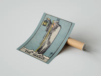 Gently curled The Hermit print beside its protective shipping tube