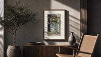 The High Priestess tarot figure poster framed above a fluted sideboard beside an olive tree