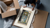 The High Priestess tarot figure framed print being unpacked from protective bubble wrap and a box