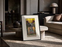 The Lovers tarot card print in a black frame leaning on a travertine table in a sunlit lounge