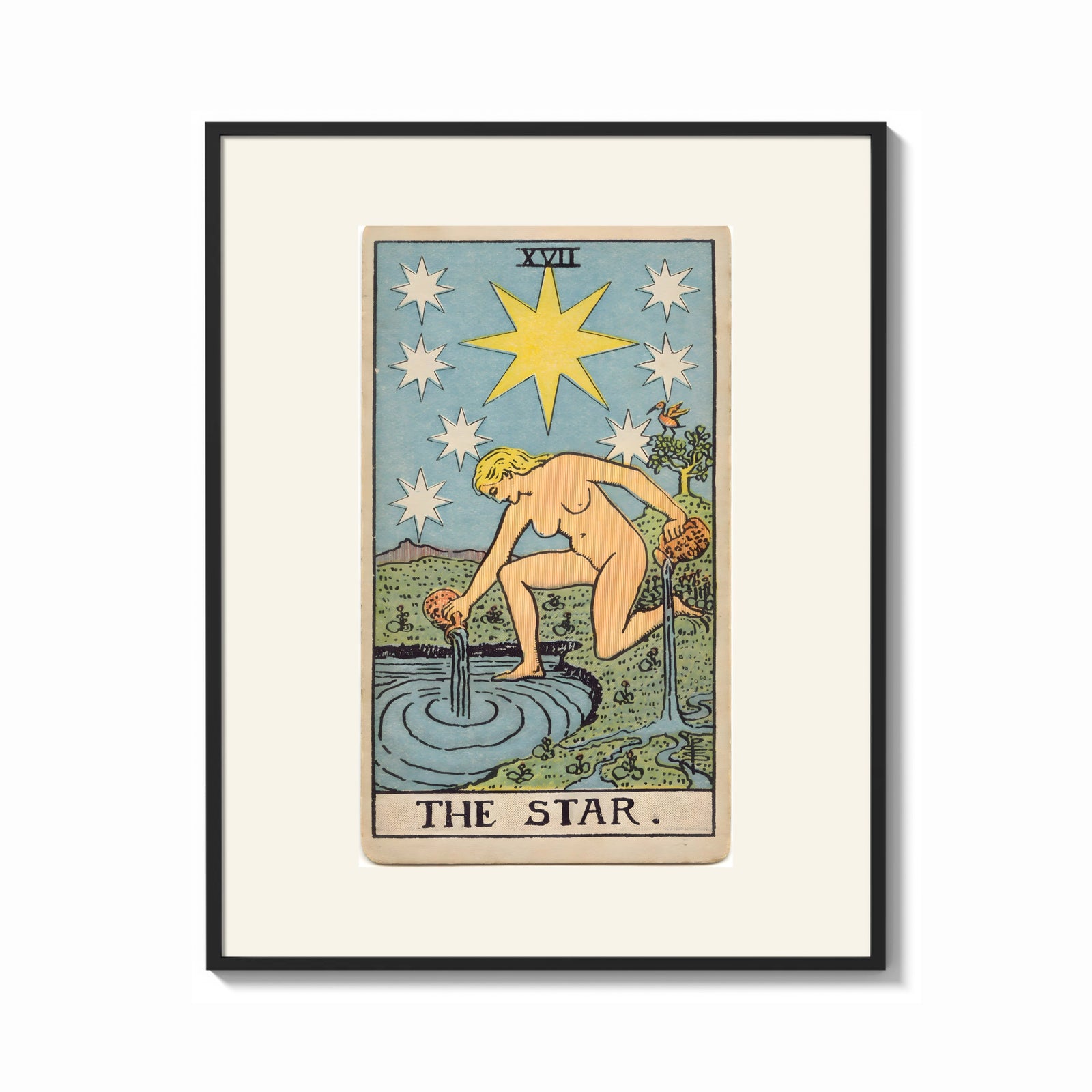 Framed The Star tarot card figure print shown as a bold statement piece on a clean gallery wall