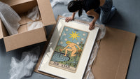 The Star tarot card figure framed print being unpacked from protective bubble wrap and a box