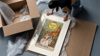 Child on white horse tarot framed print being unpacked from protective bubble wrap and a box