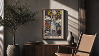 The Tower poster framed above a fluted sideboard beside a potted tree