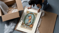 The World tarot card figure framed print being unpacked from protective bubble wrap and a box