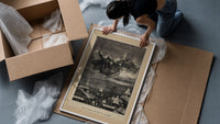 Santa Claus in reindeer sleigh over rooftops framed print being unpacked from protective bubble wrap and a box