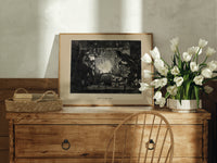 Santa Claus meeting Punch at fireplace print in an oak frame on a farmhouse dresser beside white tulips