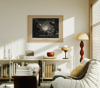 Santa Claus meeting Punch at fireplace print in an oak frame above a mid-century book console with a vintage radio