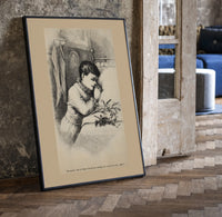 Child praying beside bed at Christmas print in a black frame leaning beside a vintage door on parquet