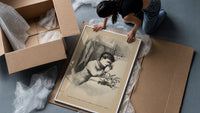 Child praying beside bed at Christmas framed print being unpacked from protective bubble wrap and a box