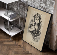 Winged Christ child holding globe with dove poster in a black frame leaning beside a shelf in a raw-plaster loft