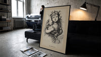 Winged Christ child holding globe with dove print in a slim black frame leaning on a dark sofa in a concrete print studio