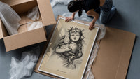 Winged Christ child holding globe with dove framed print being unpacked from protective bubble wrap and a box