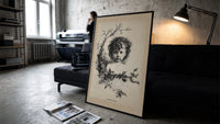 Curly-haired child's head with holly wreath print in a slim black frame leaning on a dark sofa in a concrete print studio