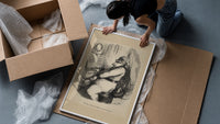 Santa Claus playing a piano framed print being unpacked from protective bubble wrap and a box