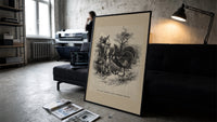 Boy facing a large turkey print in a slim black frame leaning on a dark sofa in a concrete print studio