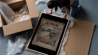 Santa in sleigh and figure riding goose framed print being unpacked from protective bubble wrap and a box