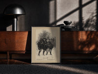 Black-framed Two children carrying Christmas evergreen boughs print on a moody console with designer coffee-table books