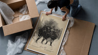 Two children carrying Christmas evergreen boughs framed print being unpacked from protective bubble wrap and a box