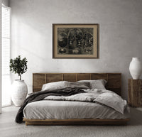 Soldier reunited with family at Christmas print in a dark wood frame above a rattan bed on a plaster wall