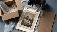 Santa Claus in sleigh on rooftop framed print being unpacked from protective bubble wrap and a box