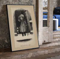 Child holding mistletoe in doorway print in a black frame leaning beside a vintage door on parquet