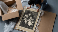 Two young children in nightgowns framed print being unpacked from protective bubble wrap and a box