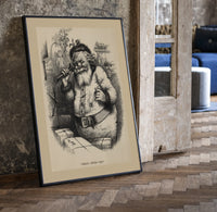 Santa Claus with pipe and telescope print in a black frame leaning beside a vintage door on parquet