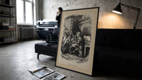 Curly-haired boy eating pie with dogs print in a slim black frame leaning on a dark sofa in a concrete print studio