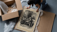 Curly-haired boy eating pie with dogs framed print being unpacked from protective bubble wrap and a box