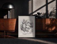Black-framed Santa Claus seated with Mother Goose print on a moody console with designer coffee-table books