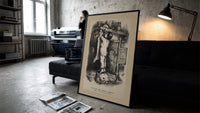 Boy nailing stocking to Christmas mantel print in a slim black frame leaning on a dark sofa in a concrete print studio