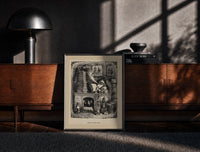 Black-framed Santa Claus reading letters at desk print on a moody console with designer coffee-table books