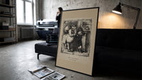 Santa Claus scolding a small boy print in a slim black frame leaning on a dark sofa in a concrete print studio