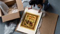 Santa Claus sewing doll clothes in workshop framed print being unpacked from protective bubble wrap and a box