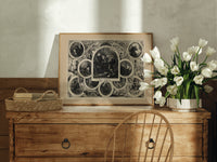 Santa Claus in vignettes of his works print in an oak frame on a farmhouse dresser beside white tulips