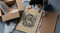 Bearded Santa Claus head in oval framed print being unpacked from protective bubble wrap and a box